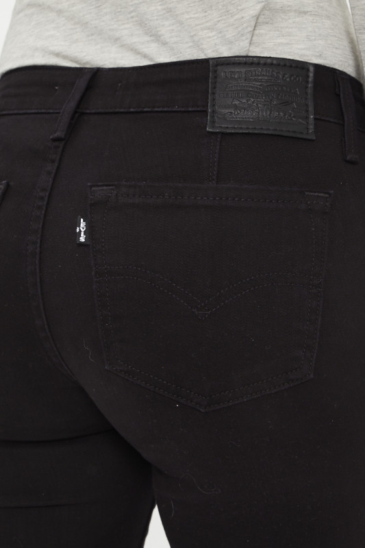 Jeans 712 noir slim à poches passepoilées femme