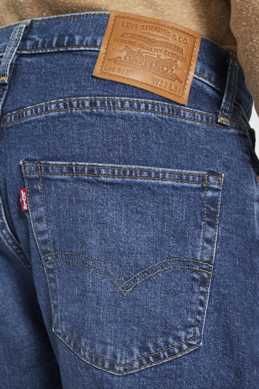 jeans coupe slim taper en coton mélangé pour homme