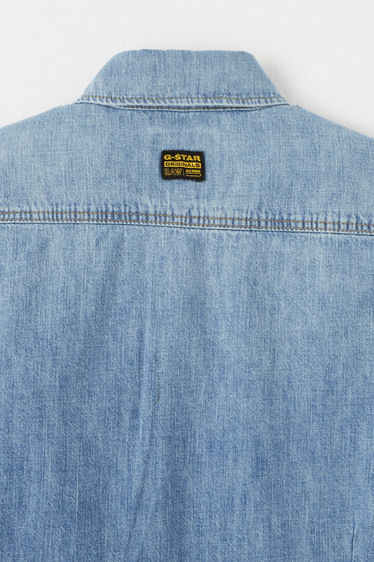 Chemise en jean bleu délavé coupe slim manches longues homme